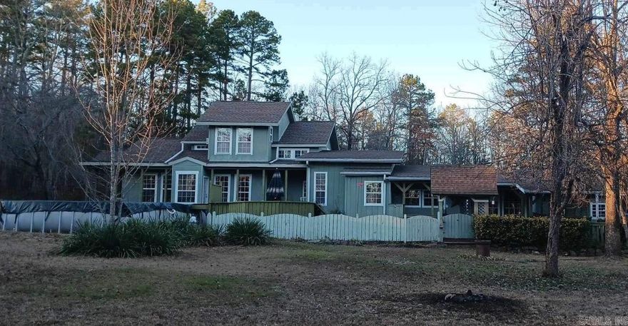 BEAUTIFUL HOME WITH SPLIT FLOORPLAN AND ACREAGE FOR ANIMALS WITH A BARN AND SHOP.