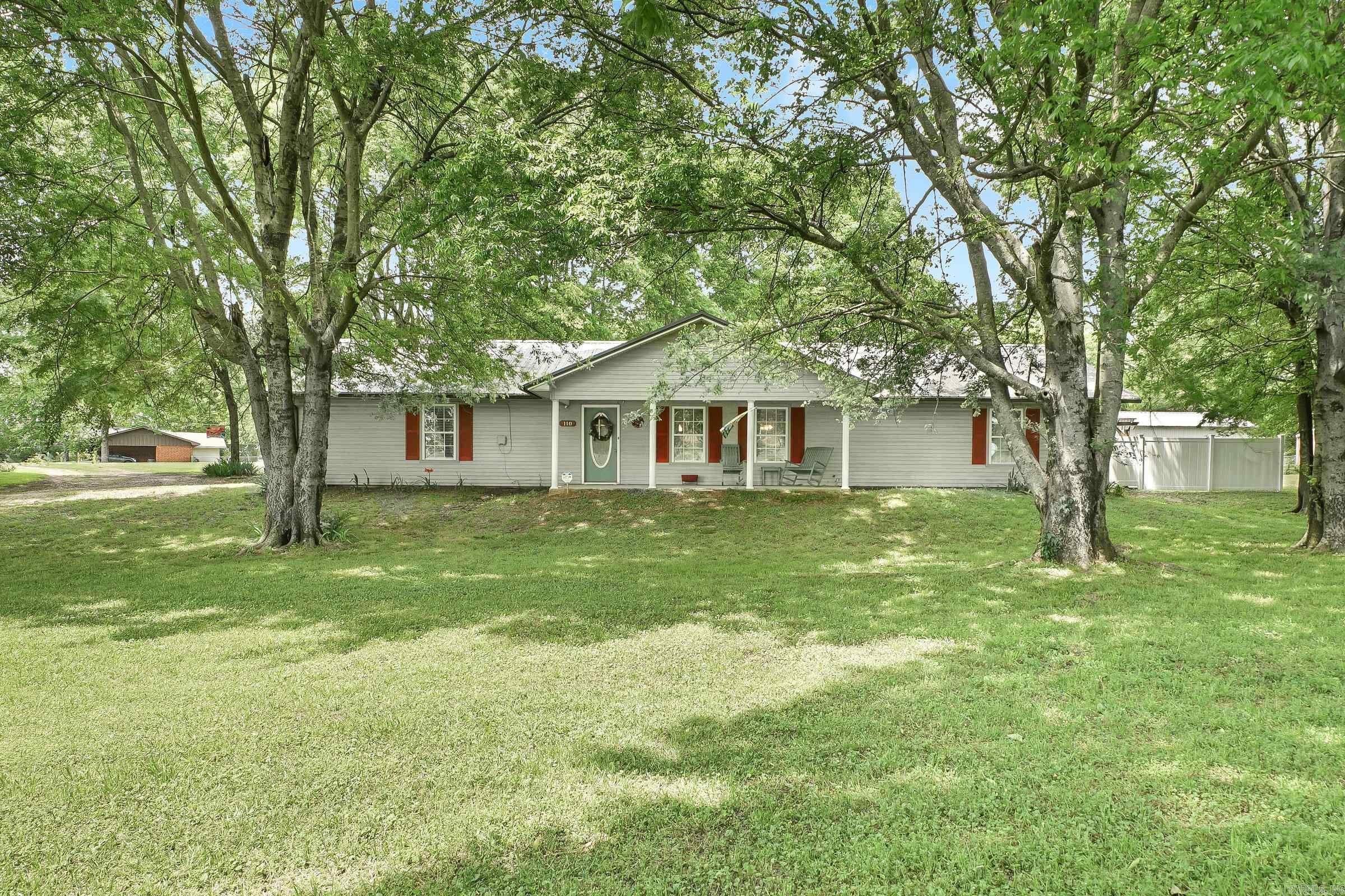 This home has just about everything! It has 1632 heated and cooled square feet. Even has the open concept! With 2 large bedrooms and 2 bathrooms, the primary bathroom is being remodeled, the large tub is being replaced by a 5 ft by 5 ft. shower and a couple of more surprises!--Need a 3rd bedroom? Well there is a 660 square foot garage that is ready to be one! Just close in the garage doors. Listen to music with the coolest sound system while you relax in the hot tub and/or take a dip in the inground pool! Large wooden fence for privacy. Then you can sit under the covered patio and just enjoy life!! Guess you would need a shop too! Well there is a 24x30 shop and it is finished inside! Do not let this one get away! Plus it is only 35 miles to popular Hochatown, 45 miles to Texarkana and just 90 miles to Hot Springs.