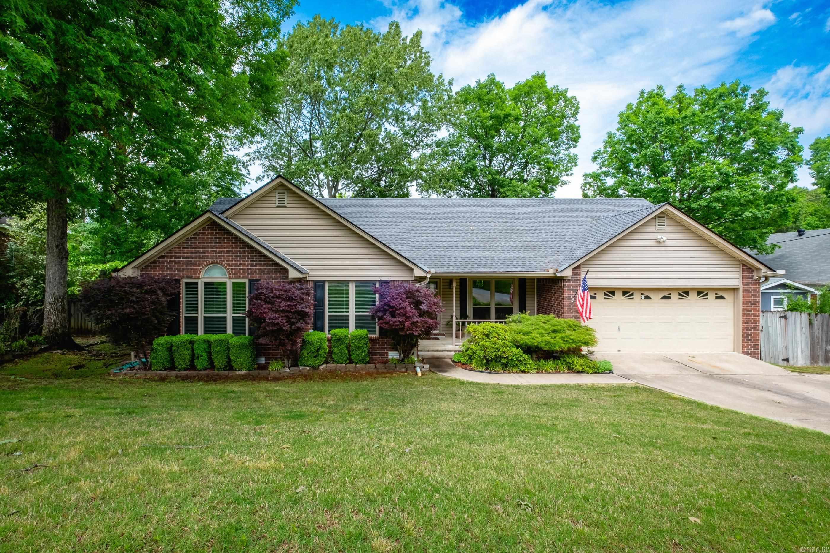 Lovely traditional family home with charming curb appeal and a sweet front porch! Step into a welcoming foyer with wood floors leading to a formal dining room and a spacious family room featuring a wood-burning fireplace with gas starter and access to the deck, perfect for entertaining. The remodeled eat-in kitchen has quartz countertops, a breakfast bar, newer appliances, wood floors, and abundant pantry and storage space. Fresh new carpet runs throughout the home. The generous primary suite includes a large vanity with two sinks, a jetted tub, and two walk-in closets. Two additional guest bedrooms share a hall bath. A fourth bedroom with its own hall bath and deck access could also serve as a home office. Youāll love the nice sized laundry room and extra storage in the two-car garage. The fully fenced backyard is a great size and shaded by mature trees. New windows and storm doors (2017), roof and gutters (2021). Come see!