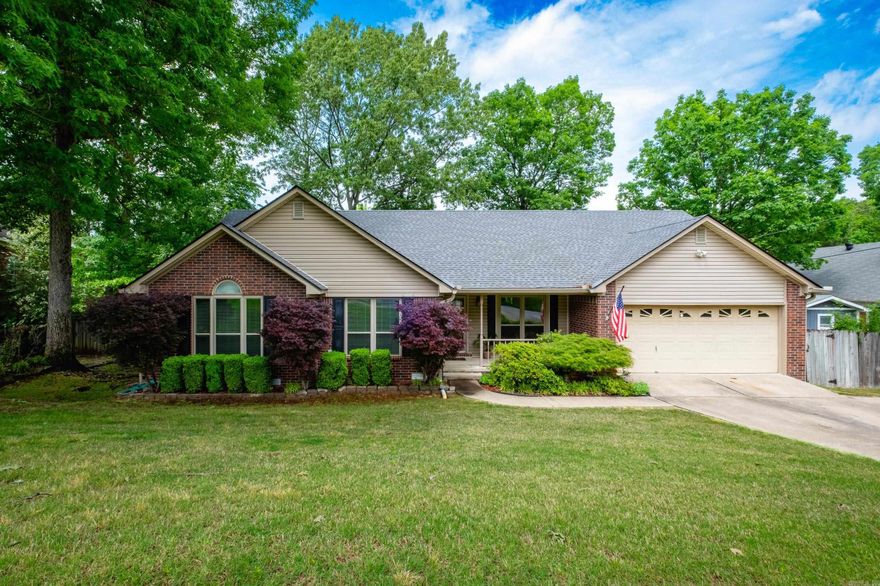 Lovely traditional family home with charming curb appeal and a sweet front porch! Step into a welcoming foyer with wood floors leading to a formal dining room and a spacious family room featuring a wood-burning fireplace with gas starter and access to the deck, perfect for entertaining. The remodeled eat-in kitchen has quartz countertops, a breakfast bar, newer appliances, wood floors, and abundant pantry and storage space. Fresh new carpet runs throughout the home. The generous primary suite includes a large vanity with two sinks, a jetted tub, and two walk-in closets. Two additional guest bedrooms share a hall bath. A fourth bedroom with its own hall bath and deck access could also serve as a home office. You’ll love the nice sized laundry room and extra storage in the two-car garage. The fully fenced backyard is a great size and shaded by mature trees. New windows and storm doors (2017), roof and gutters (2021). Come see!