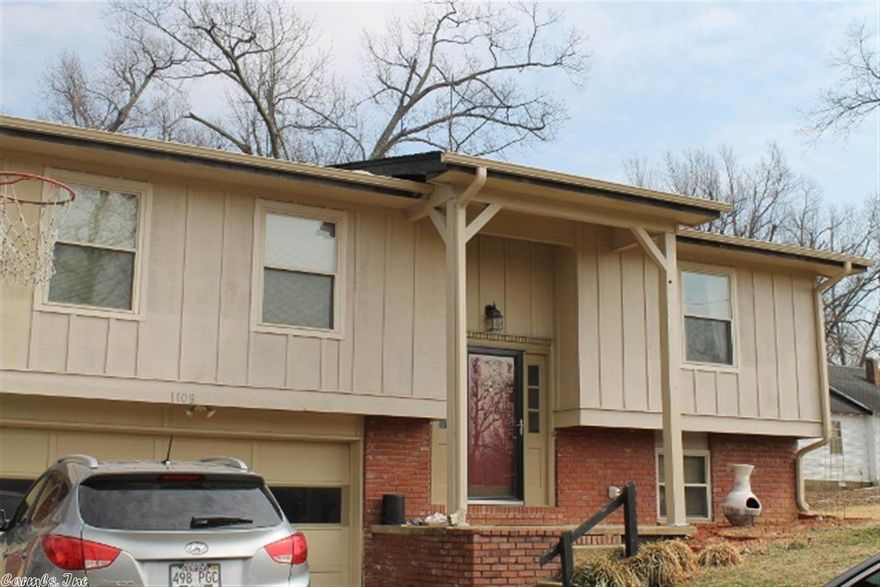 Solid family home with updates started, including new roof and decking in 2009  and fresh, neutral paint throughout. The split level floor plan has a lower level currently used as a large master bedroom. There are 3 bedrooms and 2 baths on the main level, so the lower level could also be a second living area. There is a sliding glass door in the dining area that opens to a deck with extra large, fenced backyard.