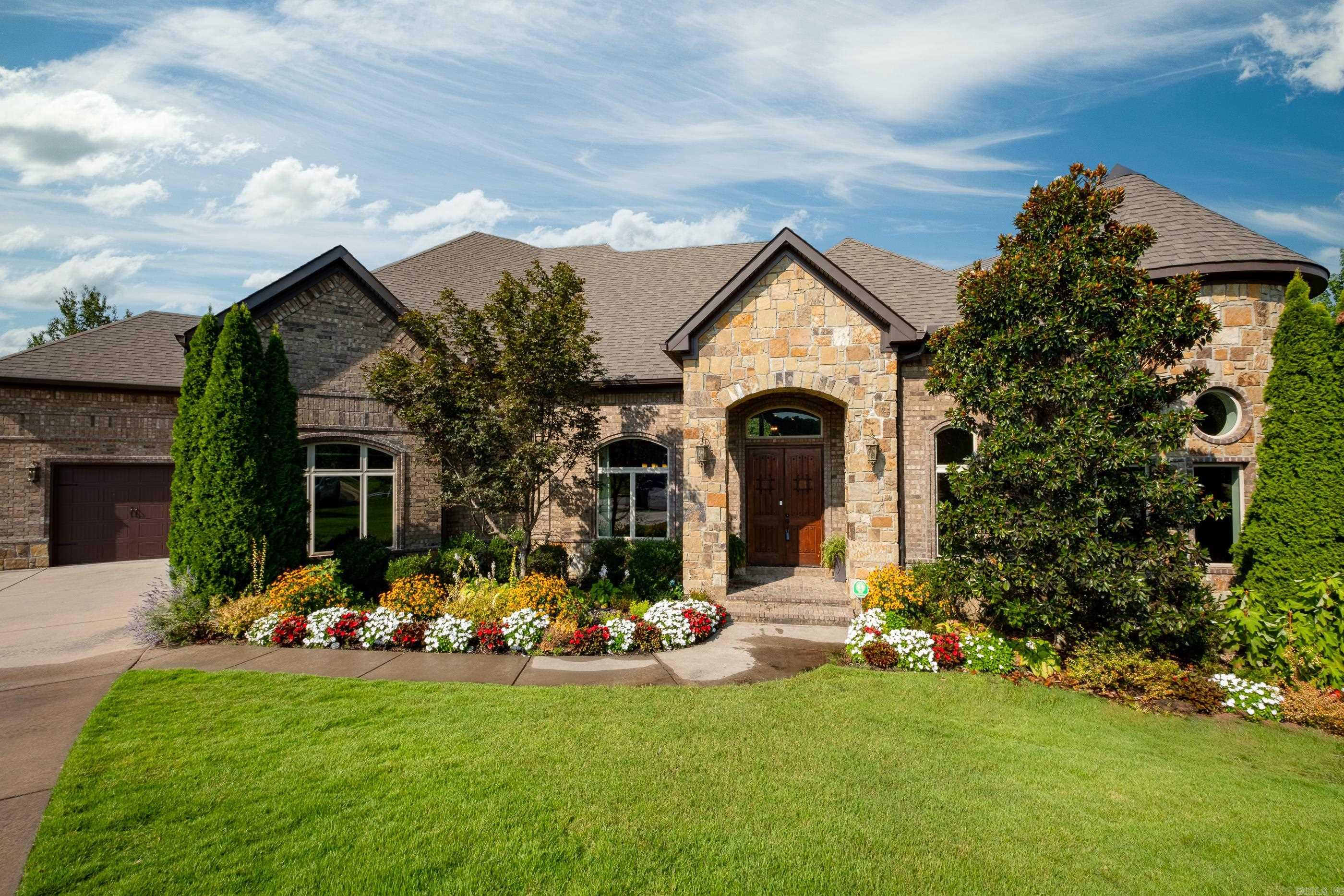 This one has it all! Custom built with every detail in mind! Three car side load garage, covered front porch and double back deck overlooking greenspace and walking trails located on a private cul de sac. Handscraped hardwoods, butlers pantry, cubbies, laundry chute and additional landscaping. Office with built ins, eat in kitchen with island, dining room, wet bar, laundry room with sink, theater room with reclining seating and downstairs bonus room with full bar and bathroom. Allo bedrooms have their own bathroom, master bath has walk through steam shower and full additional washer/dryer in master closet. A MUST SEE!