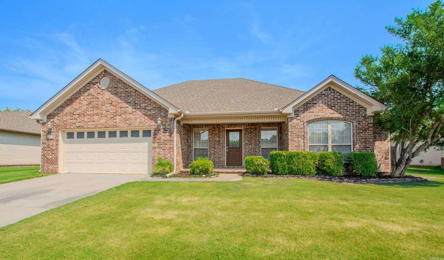 Freshly updated with full interior paint to include all cabinets inside and out, ceilings, walls, all doors, closets, and trim.  New laminate floors, granite counters in the kitchen and both bathrooms, sinks, commodes, window blinds, kitchen and hall light fixtures, door knobs, kitchen sink disposal, and freshly mulched landscaping.  Oven and microwave have been replaced in 2020 and the kitchen refrigerator conveys.  The light and airy color scheme, warm neutrals, coupled with large windows throughout, makes this house feel like home.  Split bedroom plan, open concept, Kitchen Island with breakfast bar and extra cabinet storage.  The primary bath features a double sink vanity, separate shower, and jetted tub.  Large laundry room with cabinet storage.  Extra storage room in the garage.  New architectural shingle roof installed September 2022, AC unit replaced July 2019, and new fence installed September 2018.  Partial covered back patio, large level backyard, fully privacy fenced.  Located close to quick and easy freeway access.  See Agent Remarks.