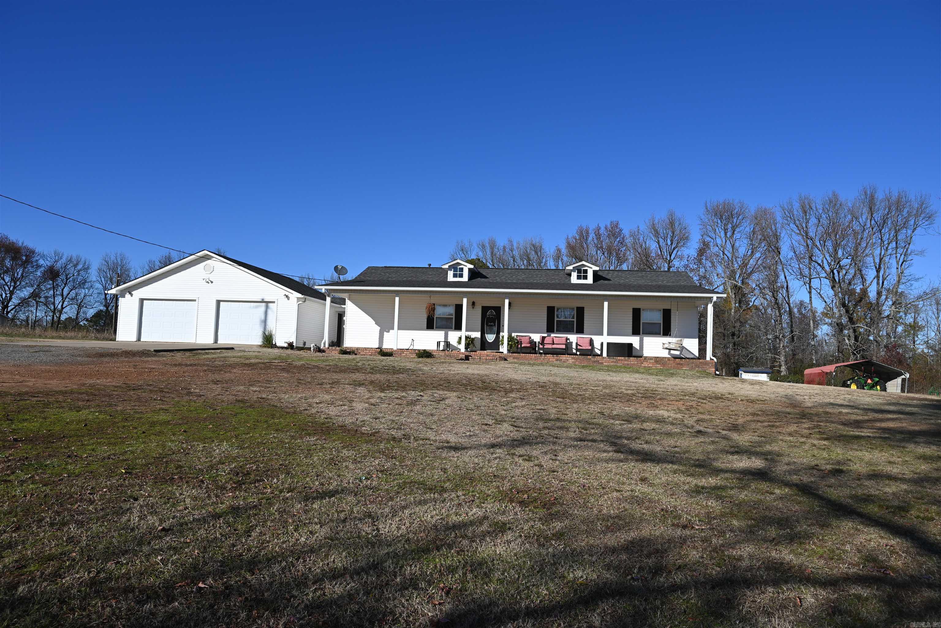 Nice 3 bed 2 bath home sitting on 3 acres with a great location  in Hector, AR. 2 car detached garage with a covered walkway to the house. Private yet close to town.