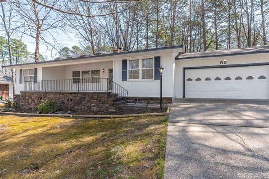 3 minutes from West Gate.  Enjoy this nice weather from the spacious front porch! The single level home has 3 bedrooms, 2 baths, Arkansas room, 2 car garage, wood burning fireplace, and fenced back yard. There is common property behind it to create a park like sitting. Laminate flooring throughout the house.  Bathrooms has been updated.  New kitchen refrigerator to convey.