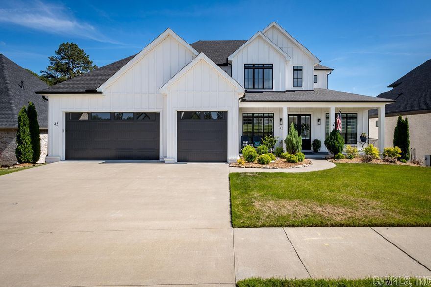 This spectacular home in Chenal Valley’s coveted Falstone neighborhood is impressive at every angle, from the soaring ceilings and balcony to the luxurious pool and covered patios overlooking greenspace. This home features elegant interiors with a modern farmhouse design and so many polished extras –  with incredible privacy, all in the heart of West Little Rock’s retail, dining and outdoor adventure destinations.  Gorgeous kitchen with an island and wet bar featuring Fisher & Paykel appliances. Special touches include designer cabinet fronts, statement lighting and railings, elevated trim, built-ins and much more. Of course, the must-see feature is that sparkling pool and hot tub– your new favorite spot all summer and beyond.