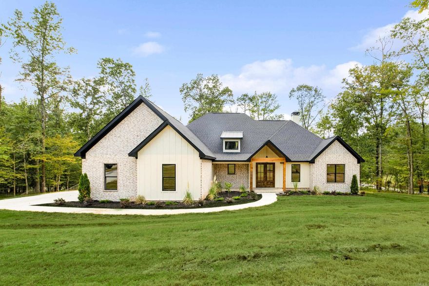 Stunning new construction in gated Big Rock Estates on 1.28 acres! This 4BR/3.5BA home features a cathedral ceiling, abundant natural light, and custom wood details. The open living area with wood-burning fireplace flows into a chef’s kitchen with quartz countertops, spacious island, gas range, and walk-in Butler’s pantry. The primary suite offers a spa-like bath with soaking tub, wraparound shower, double vanities, and oversized closet with laundry access. Upstairs includes a bonus room, bedroom, and full bath, while outside a massive covered porch with wood ceiling detail and fireplace creates the perfect entertaining space. Complete with a 3-car garage and dedicated office. Many upgrades including sprinkler system, foam insulation, and outdoor fireplace with chimney. Bryant Schools!