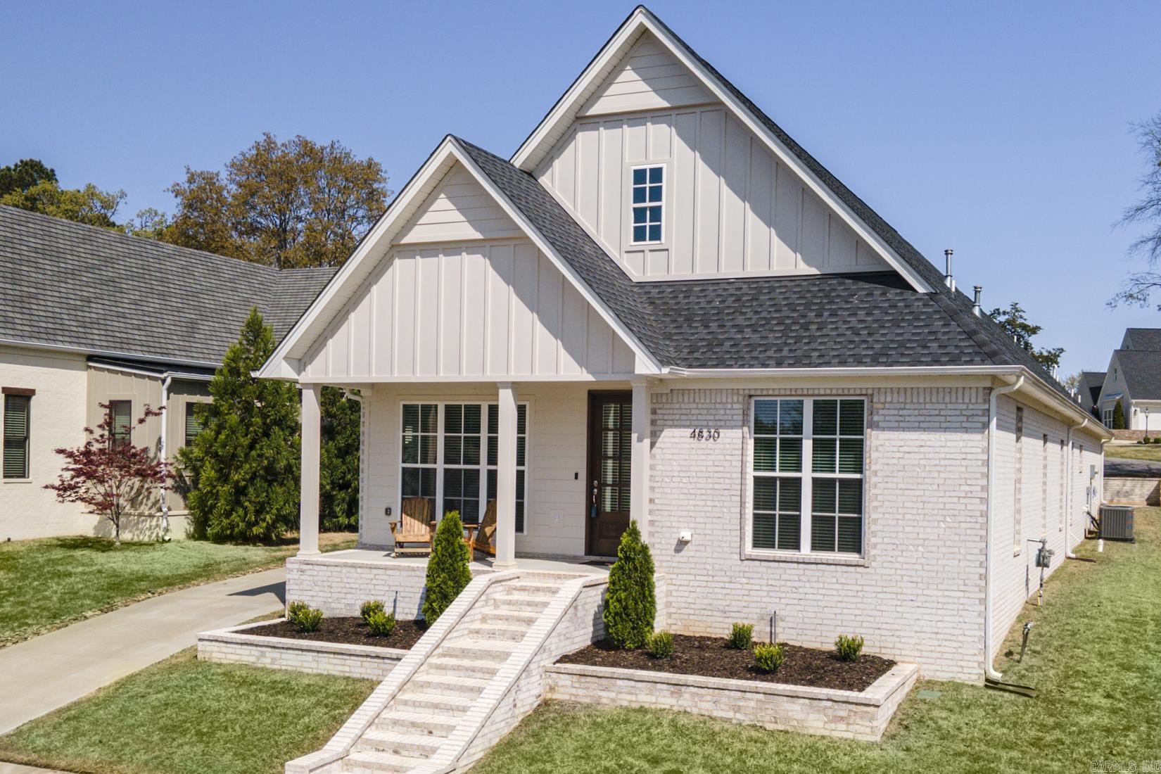 You'll fall in love with this better-than-new patio home, nestled in a peaceful and secluded neighborhood while remaining conveniently close to local amenities! This stunning property offers four bedrooms and three and a half bathrooms, seamlessly combining modern style with thoughtful functionality. Start your day on the charming front porch, the perfect spot to enjoy your morning coffee. Inside, you'll be greeted by elegant quartz countertops, gorgeous wood flooring, and a cozy gas fireplace, creating a warm and inviting living space. The luxurious primary suite is a true retreat, featuring an oversized walk-in closet and a spa-like soaker tub, perfect for unwinding at the end of the day. The well-appointed laundry room offers ample cabinet storage for added convenience, while the rear-loading two-car garage enhances both functionality and curb appeal. Designed for efficiency, this home includes a tankless water heater, ensuring modern comfort and energy savings. Plus, with low-maintenance landscaping, you'll spend less time on yard work and more time enjoying your beautiful surroundings. This home seamlessly blends contemporary amenities with a serene setting.