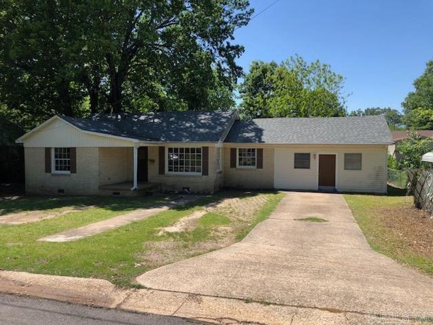 Fantastic investment or starter home opportunity! This ideally located vintage charmer is located in the heart of Downtown Benton within walking distance to Tyndall Park! Enjoy charm galore with refinished original hardwood floors and an abundance of natural light. Enjoy 4 spacious bedrooms and two full bathrooms as well as a converted garage area that could be great storage, or possibly even a secondary living area with a little imagination. The ample sized backyard features gorgeous mature trees for shade and beauty. Whether you want to rent the home out (used as a rental for many years) or make it your own, the opportunities are endless! Home to be sold as-is, where-is.  Agents, please see remarks for offers.