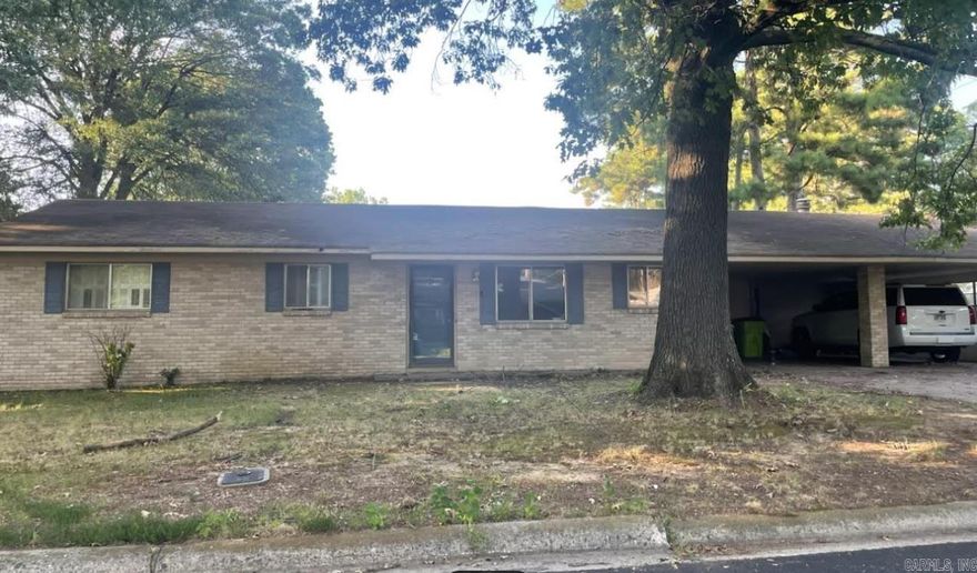 Large traditional brick home on slab in quiet sought-after west wide neighborhood. Large corner lot w/2 car carport and 2-car garage. Lots of built-ins. Two fireplaces, french doors to den. Home needs a cosmetic face lift, but so much potential for building equity. Non-functioning in-ground pool. Garden shed.