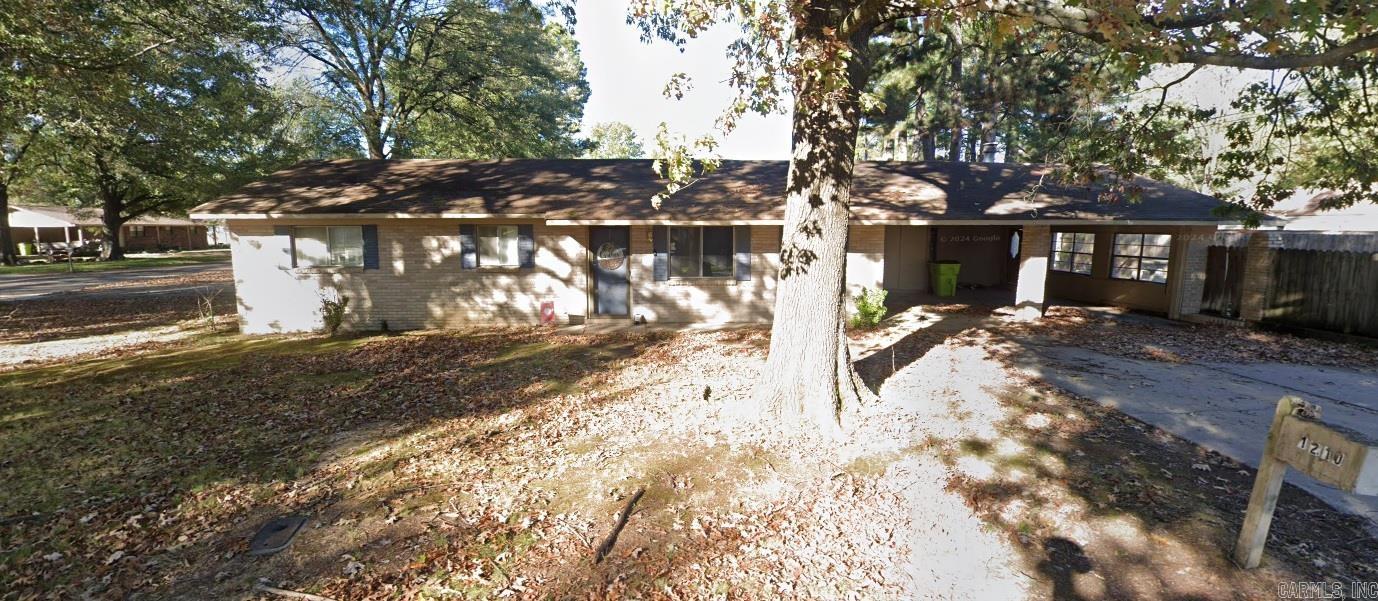 Large traditional brick home on slab in quiet sought-after west wide neighborhood. Large corner lot w/2 car carport and 2-car garage. Lots of built-ins. Two fireplaces, french doors to den. Home needs a cosmetic face lift, but so much potential for building equity. Non-functioning in-ground pool. Garden shed.