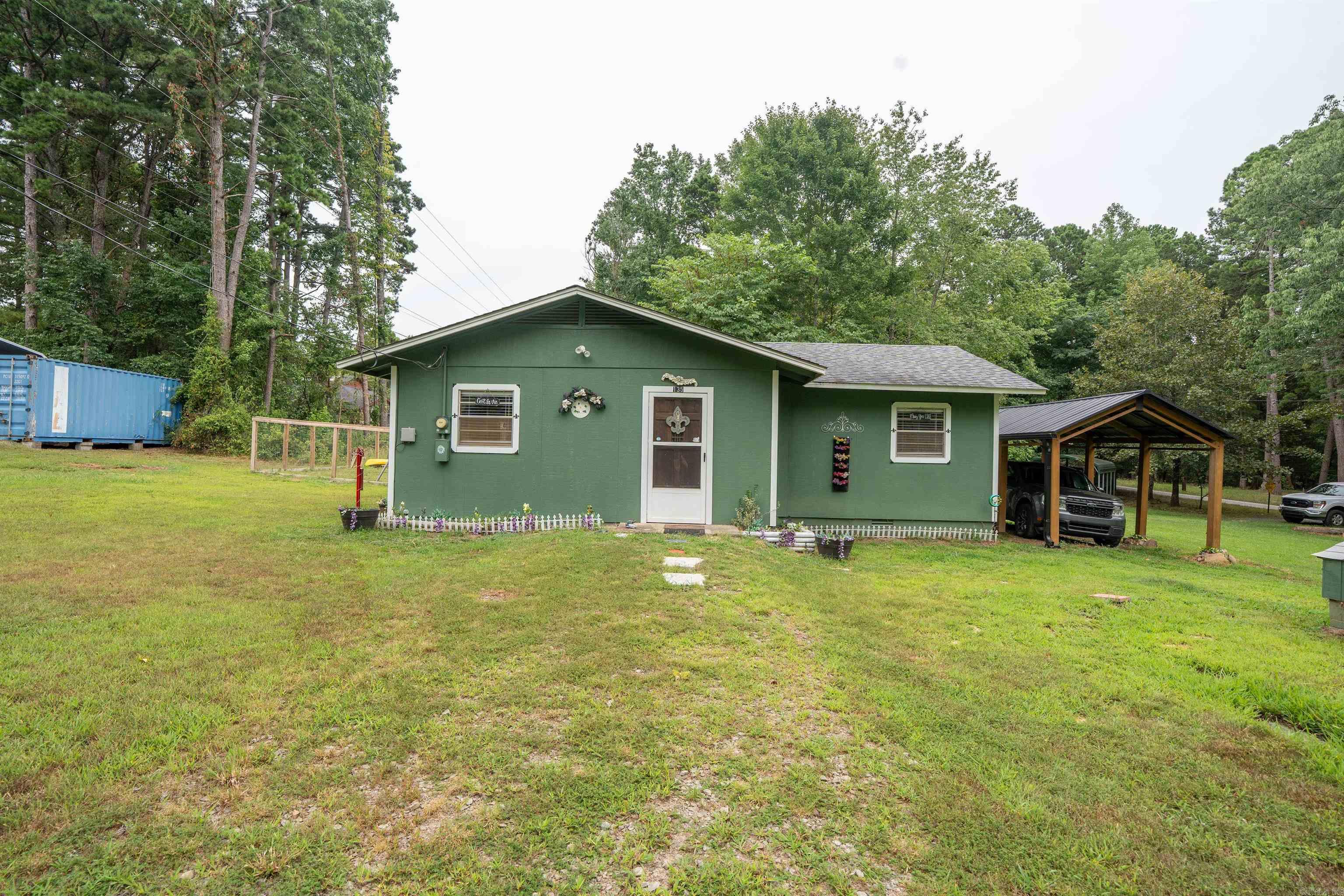 Cottage getaway at the lake. This super cute 2 bedroom 1 bath has lots of updates and an open living/kitchen concept. The updates include a new mini split, fenced yard, one car covered parking and city water. The neighborhood offers easy lake access with its own boat launch for a yearly fee of $65 to utilize.
