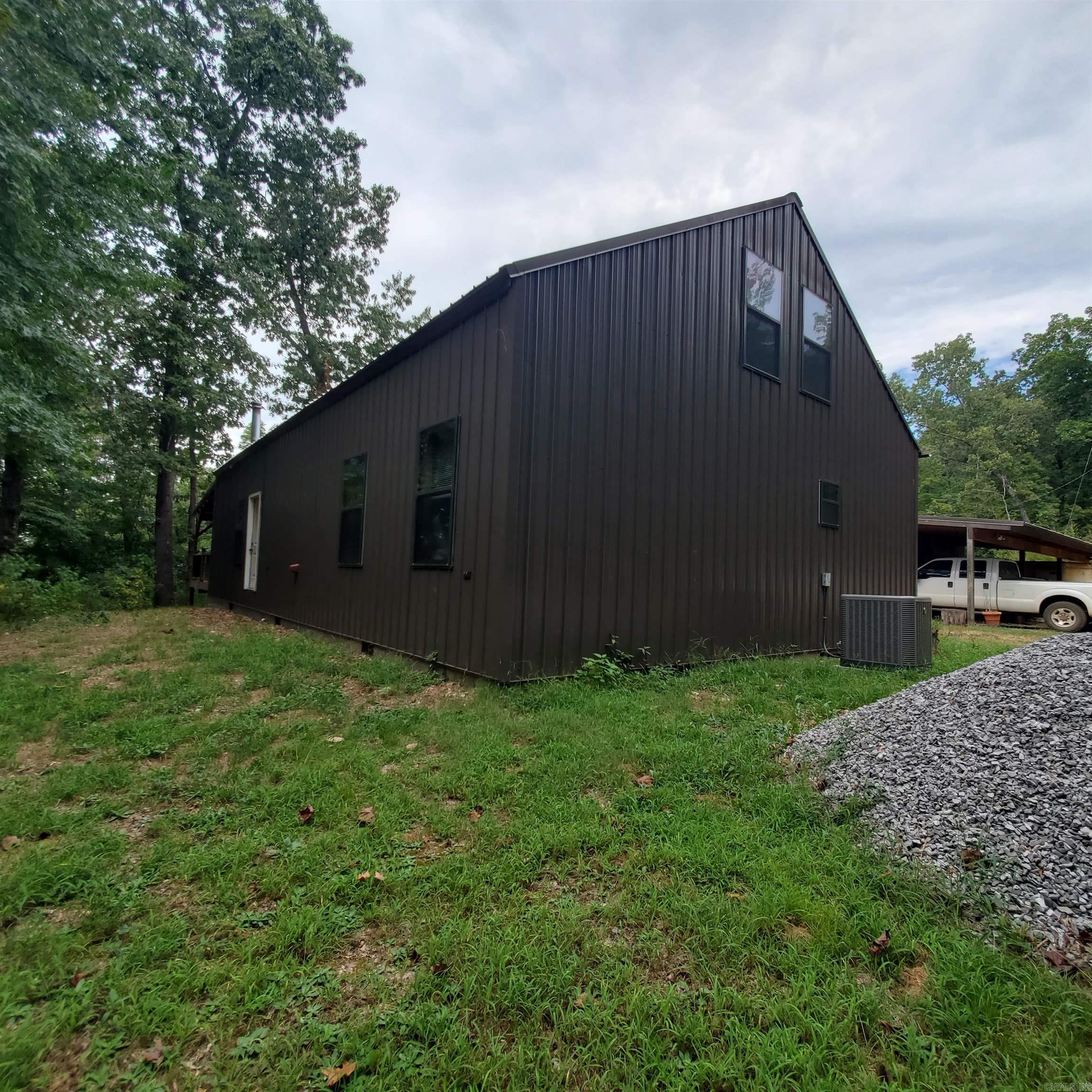This is a beautiful, custom built home with 3 bedrooms and 2 1/2 baths. Home has oak flooring throughout, hickory cabinets throughout the house with specialty drawers (spice drawers, drawer dividers. The medicine cabinets in the master bathroom have sliding barn doors. The hot water heater is tankless. Kitchen cabinets have under cabinet lighting. Wooden valences above the windows to hide the blinds. The roof was replaced in the last month. There is a wood-burning stove for a warm cozy fire in the winter with a wood shed for storage. The list goes on. Full house and shop generator with its own propane tank. A 30 ft x 50 ft shop with an office and a bathroom. A 10ft x 10 ft storage building for all of your storage needs. Home is on a well. All of this on 10 acres in the country. Oh and I might add, there are bee hives that would convey if you want to become a beekeeper!