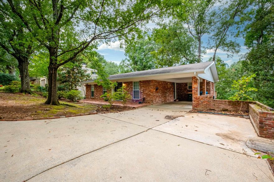 Discover this beautifully remodeled 3 bedroom, 2.5 bath home in Hillcrest convenient to all the restaurants, shops, and neighborhood favorites. Thoughtfully updated with hardwood floors and chic white cabinetry throughout, this home features an open kitchen with a marble island, top of the line appliances, stylish finishes, and windows that provide abundant natural light. The primary suite is on the main level along with a living area, dining room and laundry.  Downstairs, you'll find a versatile second living area plus extra space for an art studio, office, workshop, or additional storage. Relax on the screened porch overlooking the private backyard filled with mature trees, or take in the view from the upper deck that feels like a wooded retreat.   Enjoy the peaceful, secluded setting while being minutes away from both Hillcrest and Alsopp Park. Washer, dryer, and refrigerator all convey, making this move in ready home an easy choice!