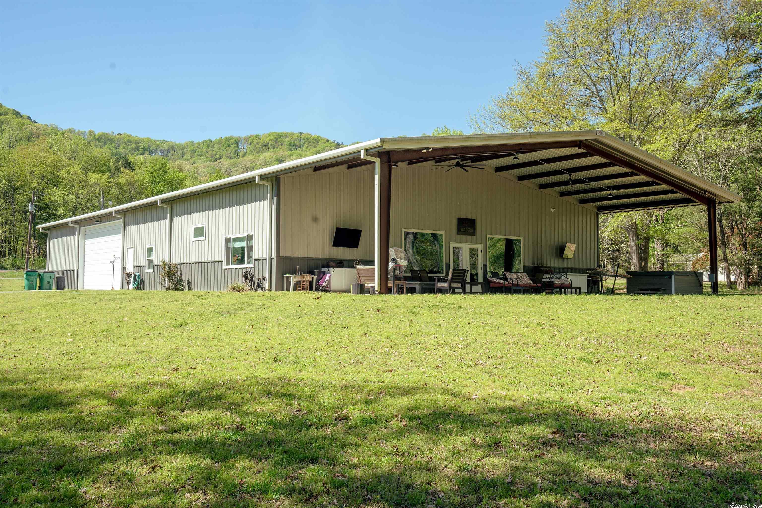 Barndominium at its best! This 6000 square foot dwelling sits on 4.19 acres, offers two separate living areas with a heated and cooled shop space in between. Insulated, framed interior walls with a 24" air gap insure a very energy efficient home. This property offers high quality craftsmanship throughout, exceptional cabinetry, chefs kitchen, spacious walk-in closets, massive living area with vaulted ceilings and open concept to the kitchen. The 2100 square foot shop area features two automatic garage doors on each side allowing for easy pass through access for your boat and trailer or outdoor toys! The main living space is approximately 3000 sq feet, 2 bedroom, 2.5 bath with office or optional 3rd bedroom. The apartment space is a 2 bedroom, 1.5 bath with full kitchen. Step out onto the 20x60 covered porch/outdoor entertainment area from the living room and enjoy the night in your hot tub! Conveniently located just off of Hwy 337, within 3 miles of Lobo Landing on the Little Red River and 6 miles to Dam Site Recreational Area on Greers Ferry Lake. This is a must see property!