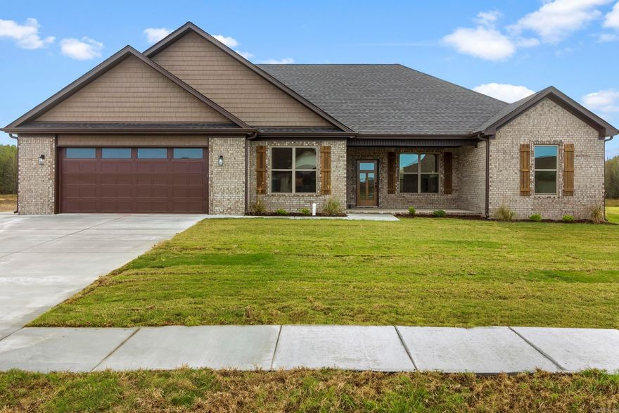 Welcome to your new home! This stunning new build features 4 spacious bedrooms with a split floor plan, 2.5 baths, and a covered back patio that can be accessed from the primary suite and living room. The gourmet kitchen boasts a gas range, built-in microwave, pantry, custom cabinetry, and sleek quartz countertops, making meal prep a breeze. The primary suite includes an ensuite bath and walk-in closet with an island for added storage and convenience. The thoughtfully designed laundry room offers lockers, a folding table, and hanging rack. Extended parking pad in driveway. Make this stunning and functional house your home! Completion in October 2024.