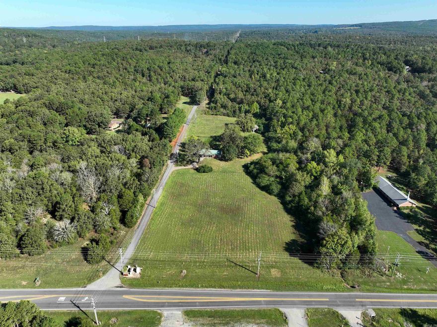 Prime 2-acre commercial opportunity just outside of Heber Springs in the path of new and expanding development, featuring magnificent views of Sugarloaf Mountain. Ideally positioned in a well-traveled corridor less than one mile from the Swinging Bridge access on the Little Red River and directly across from the Sugarloaf Mountain Trailhead and the historic Sugarloaf Mountain Dance Hall, this location benefits from steady local and visitor traffic year-round. Surrounded by ongoing growth, the site is well-suited for restaurant, medical, retail, office, or mixed commercial development. A rare opportunity to secure highly visible commercial ground in one of the area’s most active and scenic corridors.