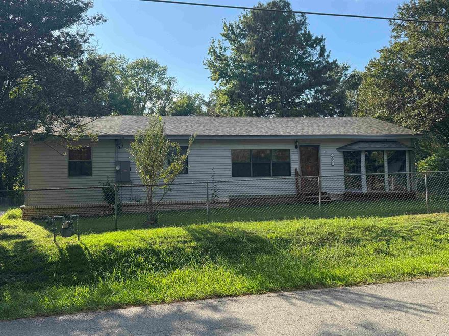 Fixer-Upper/DIY project.  Spacious house with lots of potential.  Includes a 12' x 25' glassed-in sunroom.  A second large living area separate from the living room/dining room area.  Detached 32' x 34' garage/workshop plus two additional storage buildings onsite.  Wheelchair accessible ramp in backyard.