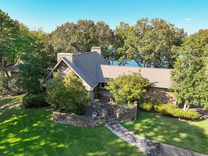 Heber Springs mostly furnished LAKEFRONT HOME on 2.25 acres!  With the lake on two side of your lot, this home is located in one of the very nicest subdivisions in Heber!  Great views of Greers Ferry Lake to the north, shaded nicely in the afternoons!  Large living area with cathedral ceilings, 3 bedrooms on the main level including the primary suite with sitting area and updated bath!  Upstairs is a spacious loft bedroom (5th bedroom) and downstairs is a wonderful family room (with pool table) and another large bedroom and bath.  Kitchen with eat-in dining, separate formal dining and breakfast bar.  Laundry has sink, W&D, large refrigerator and full-sized wine cooler.  Ample storage in walk-out basement, 2-car garage, beautiful deck and stone patio overlooking Greers Ferry Lake!  3 fireplaces, easy walk to the water!  5 minutes from Heber Springs Marina!!!  The perfect "family home"!!!