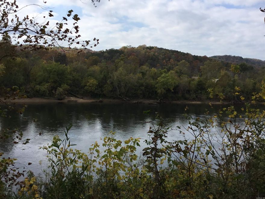 Dreaming of Living or owning a retreat on the White River? Here’s your chance to make it happen! This beautiful 1.27-acre property in Mount Olive offers 300 feet of White River frontage, with elevated River views. Step out your door to trout fish or take a drive (just a few hundred feet) to the community boat launch. No need to invest in an RV: this lot already includes a 36-foot CrossRoads Cruiser that’s fully set up and ready to enjoy. The 1 & 1/2 Bath RV sleeps 8, with bunk room, features an outdoor kitchen, two A/C units, an electric fireplace, and a secure RV cover bolted down to handle the wind. All utilities are in place: well, electricity, and septic. Telephone service is available, but WiFi works great if you prefer to stay connected that way. Inside, you’ll find: Electric fireplace, Full kitchen, Two recliners, Sofa that opens into a full-size bed with a bamboo mattress, 2 A/C and gas furnace for heating, Three slide-outs with convenient switches, Electric or gas water heater, Additional details: Both propane bottles are full, Two grey/black water tanks and a 50-gallon potable water tank, Brand-new upgraded tires (only 435 miles on them)