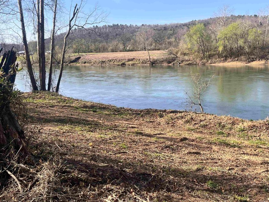 Dreaming of Living or owning a retreat on the White River? Here’s your chance to make it happen! This beautiful 1.27-acre property in Mount Olive offers 300 feet of White River frontage, with elevated River views. Step out your door to trout fish or take a drive (just a few hundred feet) to the community boat launch. No need to invest in an RV: this lot already includes a 36-foot CrossRoads Cruiser that’s fully set up and ready to enjoy. The 1 & 1/2 Bath RV sleeps 8, with bunk room, features an outdoor kitchen, two A/C units, an electric fireplace, and a secure RV cover bolted down to handle the wind. All utilities are in place: well, electricity, and septic. Telephone service is available, but WiFi works great if you prefer to stay connected that way. Inside, you’ll find: Electric fireplace, Full kitchen, Two recliners, Sofa that opens into a full-size bed with a bamboo mattress, 2 A/C and gas furnace for heating, Three slide-outs with convenient switches, Electric or gas water heater, Additional details: Both propane bottles are full, Two grey/black water tanks and a 50-gallon potable water tank, Brand-new upgraded tires(only 435 miles on them)(Property can be sold without RV