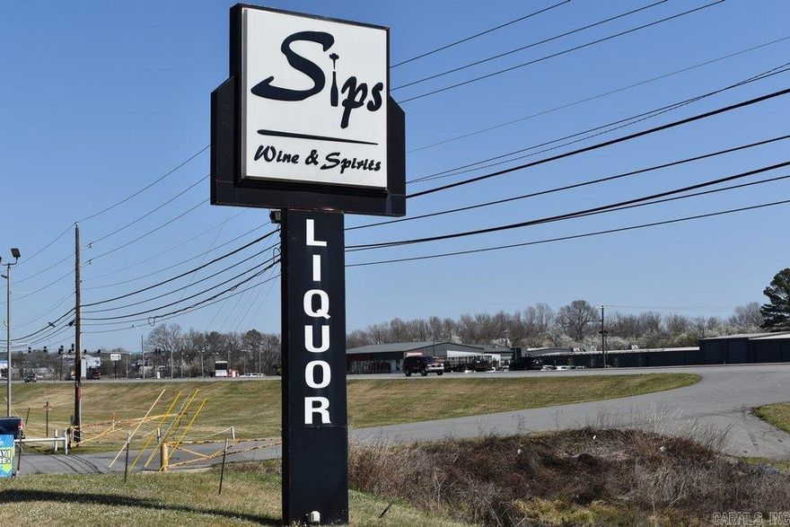 Beautifully renovated and thoughtfully designed liquor store building offering an inviting atmosphere and a well-established clientele. This 4,300+ SF building with land is ideally located in a high-traffic, high-visibility area on S. University Ave., just off the Interstate-30 exit, offering excellent access and exposure. The business is currently operating with positive income and has strong potential for expansion into a larger-scale, higher-profit operation. Zoned C-4 Commercial, the property allows a wide range of uses including office, restaurants, and entertainment to be added to the liquor business. Situated on approximately 2.25 acres, the fully paved lot provides 50+ parking spaces and currently hosting multiple food vendors to increase overall foot traffic. Additional features include a convenient drive-through window, large walk-in cooler extending behind all display cooler units for efficient loading, private office, coffee room, and abundant storage space. The lease of the building must include the purchase of the liquor permit at $180K to be collected prior to commencement of the lease. *Seller may sell the liquor permit alone without a lease.