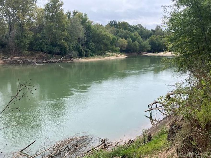 Escape to your own private riverfront haven on the beautiful Current River in Randolph County. Nice level approximately 9 acres M/L just out of Pocahontas featuring over 640 feet of river frontage, some bottomland timber and a previously cleared area that would be a good place for an off grid cabin or camper.   This property is located in Fema flood zone A.  Seller will consider owner financing to qualified buyer with 10% down payment.