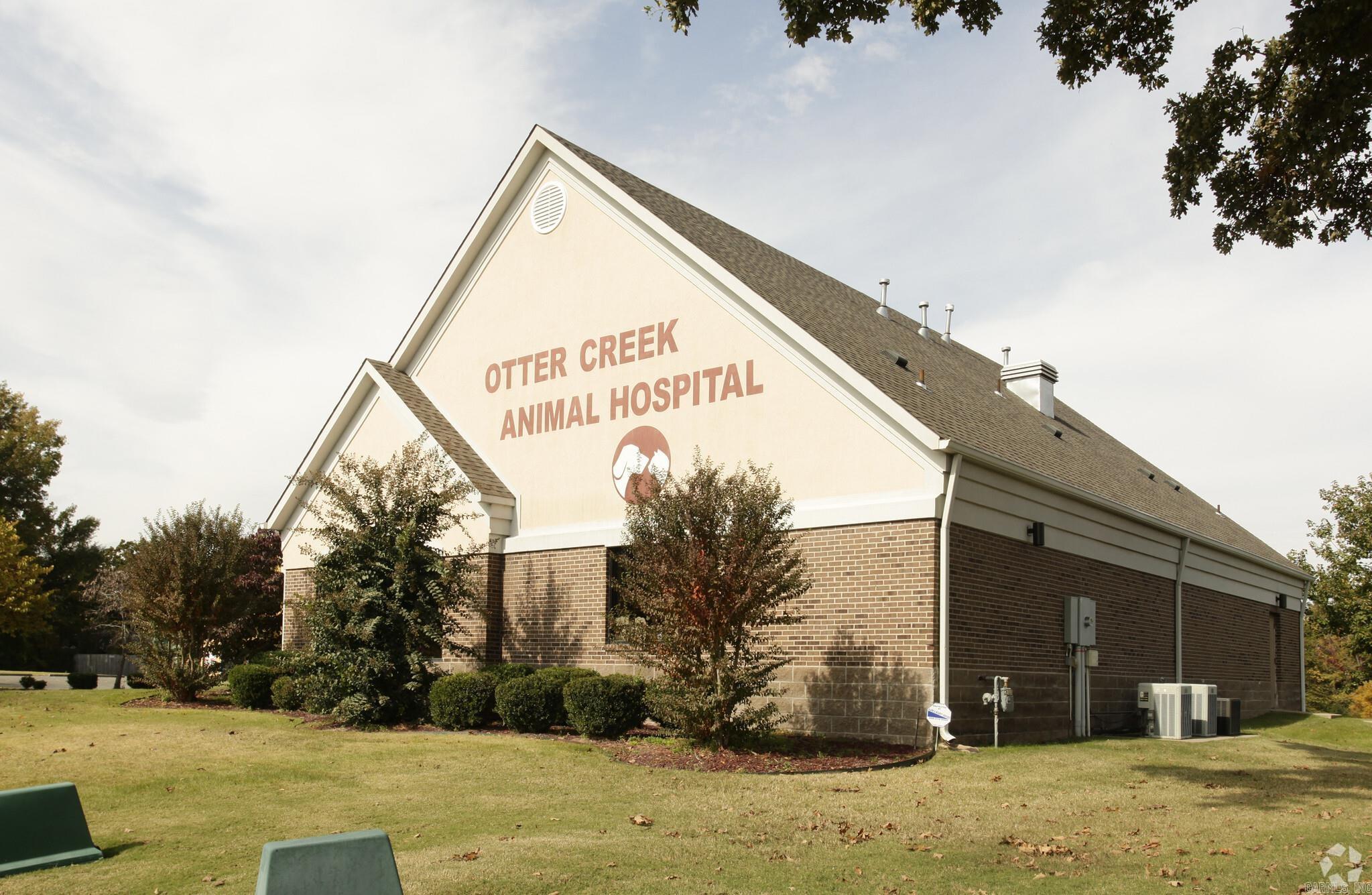 Prime commercial property in the desirable Otter Creek neighborhood of Little Rock, AR. This property, previously a veterinary clinic, offers a turnkey setup for a new animal hospital or adaptable for other medical or commercial uses. Features include a large reception area, 4 exam rooms (3 with plumbing), a surgery room with lighting, lab area, doctor's office, break room, kennel area with extensive plumbing, washer/dryer, 2 ADA restrooms, and a sprinkler system. Ample parking is available, with potential for more. Located in a sought-after area with easy access to shopping centers like Bass Pro Shops and the Outlets of Little Rock, schools, and major highways. Currently leased to a non-medical company supporting the Little Rock school district, providing potential income for the buyer until the lease term ends.