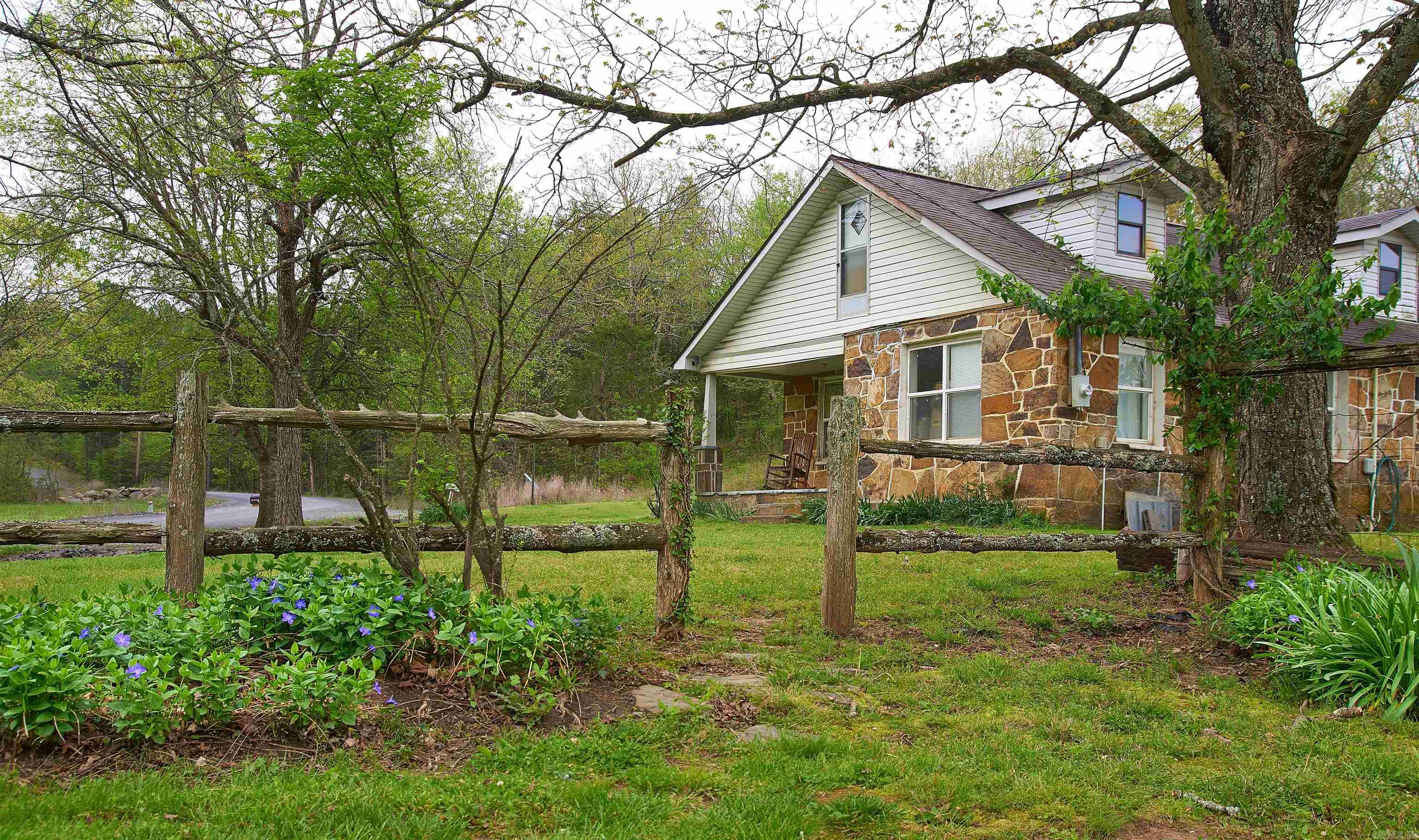 Youāve been dreaming for years of escaping the city & moving to the countryside. Here is your chance to design your perfect homestead on this 15-acre haven located in a beautiful Ozark valley. Bring your horses, cows & chickens. Plant a garden and enjoy the harvest from the vineyard. There are two charming old farmhouses and a rustic barn, plus a fun small barn with a viewing area for the kids. The main rock house is a 3 bedroom with an upstairs bonus room and was built in 1912 and added on and fully remodeled in 1997. It has preparations for a master en-suite & a great room to be added with an amazing view. The guest house is a 2 bedroom with a shop & upstairs loft perfect for a VRBO, in-laws, or farm hands house. Barn is 1940ās with 4 interior & 4 exterior horse stalls, feed room, tack closet, workshop & has electric & well water. And once your chores are done, you can load up the family and head to Greers Ferry Lake (just 8 miles away) for a refreshing day on the water. This is the rural paradise youāve been searching for. City water and also has water wells. If you want more acreage, see Listing #25011623 $575,000 32 acres, vineyard and remodeled shop with concrete pad