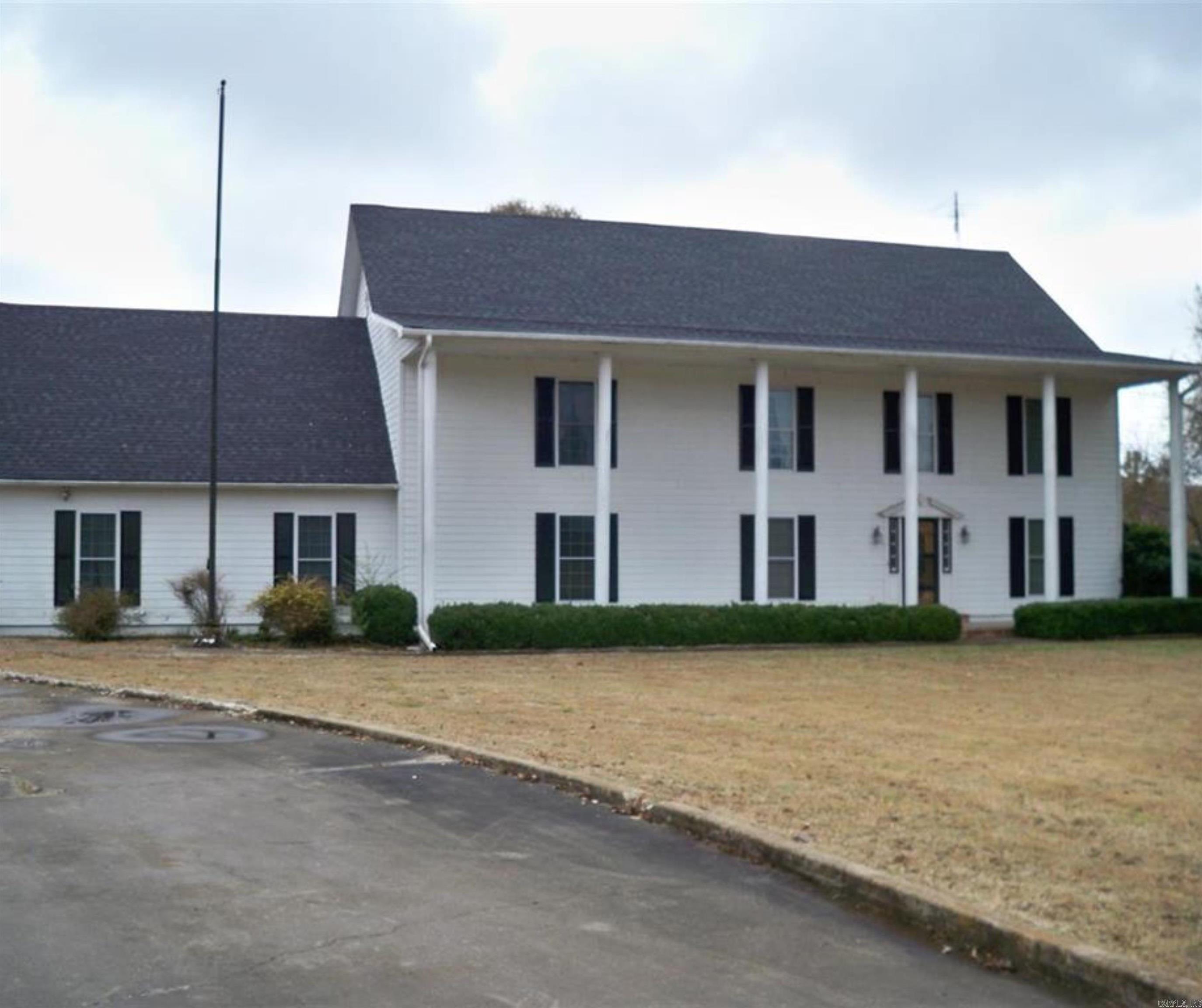 2.95 Acres of property zoned UT. If purchasing as a fulltime residence you will be required to apply for residential zoning. 5 bedroom 3 and a half bath home. Double ovens in the kitchen, granite countertops, and has 8X8 ceramic tile. Gas Log fireplace in the den. The study is off the front entry. Separate Dining. Bonus room downstairs that can be used for large sunroom but does have a window unit. Upstairs 2 large primary bedrooms, 2 additional bedrooms as well. Property fenced in. This property has so much potential if you are looking for renovation opportunities.