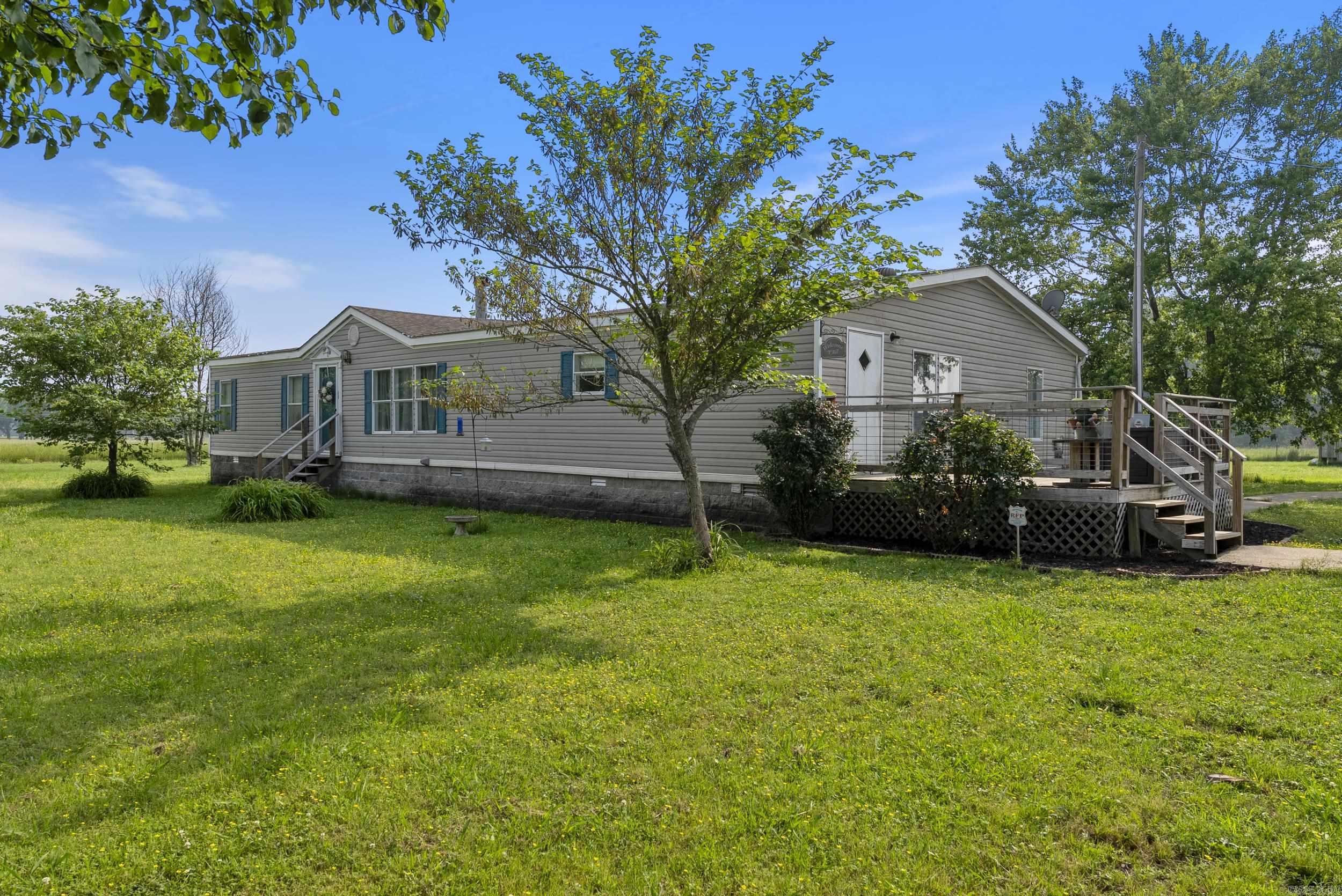 Welcome to your own slice of country paradise! Nestled on 10 stunning acres, this spacious 2,240 sq. ft. home offers peace, privacy, and plenty of room to grow. Built in 2000, this well-maintained residence features three bedrooms, two full bathrooms, and two generous living spaces – perfect for entertaining or relaxing with family. The main living room boasts a cozy wood-burning fireplace, ideal for those chilly Arkansas evenings, while the updated deck provides the perfect outdoor space to enjoy your morning coffee or evening sunsets. Enjoy peace of mind with a brand-new HVAC system installed in December 2023, and a NEW ROOF just installed!! – major updates that add value and longevity to your investment. Whether you’re looking for a private homestead, a family-friendly retreat, or simply room to roam, this property has it all. Don’t miss this opportunity to enjoy country living just minutes from town. Schedule your showing today and discover all that 190 Lebanon Rd. has to offer!
