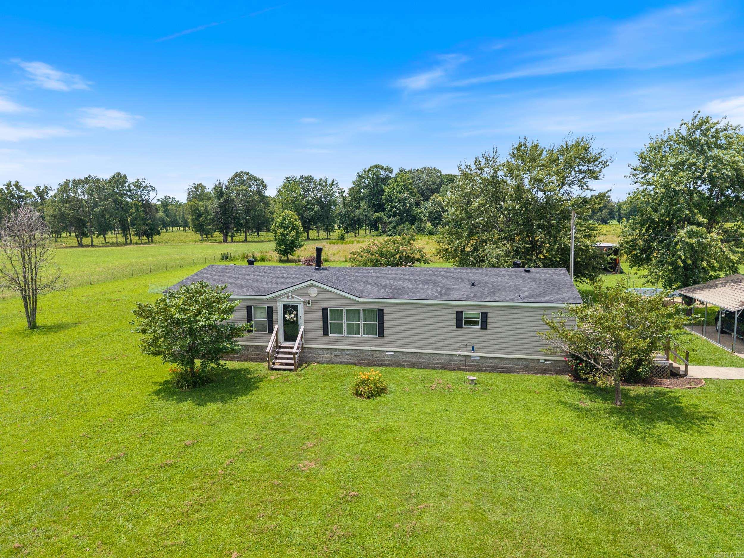 Welcome to your own slice of country paradise! Nestled on 10 stunning acres, this spacious 2,240 sq. ft. home offers peace, privacy, and plenty of room to grow. Built in 2000, this well-maintained residence features three bedrooms, two full bathrooms, and two generous living spaces ā perfect for entertaining or relaxing with family. The main living room boasts a cozy wood-burning fireplace, ideal for those chilly Arkansas evenings, while the updated deck provides the perfect outdoor space to enjoy your morning coffee or evening sunsets. Enjoy peace of mind with a brand-new HVAC system installed in December 2023, and a NEW ROOF just installed!! ā major updates that add value and longevity to your investment. Whether youāre looking for a private homestead, a family-friendly retreat, or simply room to roam, this property has it all. Donāt miss this opportunity to enjoy country living just minutes from town. Schedule your showing today and discover all that 190 Lebanon Rd. has to offer!