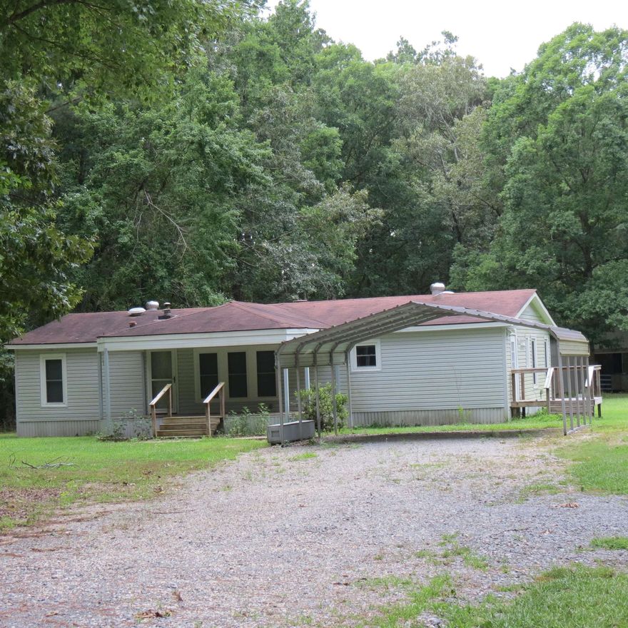 Beautiful home in the country.  This well maintained 3 bedroom 2 bath doublewide mobile home has a split floor plan, electric fireplace, vaulted ceilings, SS appliances, new hot water heater 12/22.  Nice porch to watch the wildlife.  Nice barn with stalls, floored storage room with electricity, and a loft.  Bring your livestock and come on and see this move in ready home!  Call me today for your personal tour.  There are lenders that will do mobile home loans and some even offer downpayment and closing costs assistance.