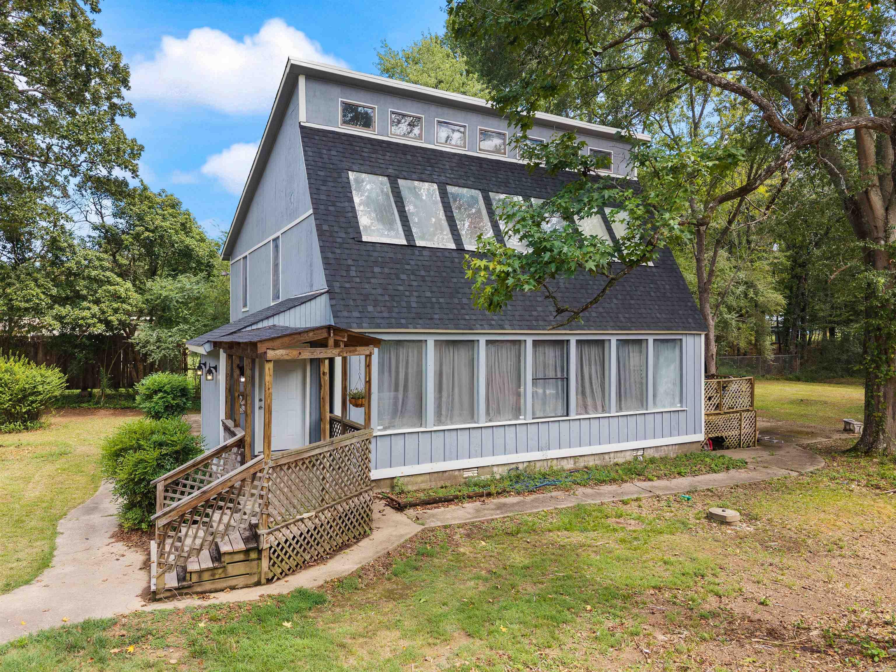 Welcome to this stunning contemporary farmhouse set on a rare double lot with 1.4 acres in the heart of Little Rock. At only 8 minutes from the Chenal Promenade, this unique property combines modern updates with timeless style, offering plenty of space inside and out. Step inside to find fresh interior paint, a beautifully renovated primary bath, and a versatile flex space perfect for a home office, playroom, or guest retreat. The home has been thoughtfully updated with a new roof, new exterior paint and siding repairs, and two new HVAC units for comfort and peace of mind. With its spacious layout, private setting, and stylish design, this property is ideal for those who want both charm and functionality. Whether you’re relaxing on the grounds, entertaining, or enjoying the convenience of its central location, this home truly has it all. Outdoor storage stays, so you'll have room for everything you need. Don’t miss your chance to own this one-of-a-kind Little Rock gem! Agents, see remarks and docs for any additional info.