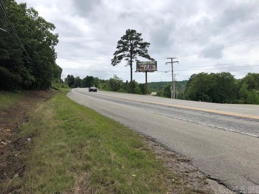 Great Highway frontage across the hwy from Bridal Fails, and just down the hill from Red River Dodge, wooded property with a view!!!!!  Would make a great estate or could be used for commercial purposes, business or pleasure this property has it all. MINERAL RIGHTS DO NOT CONVEY.  Great location