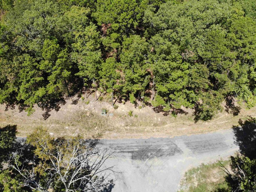 BOAT SLIP!!! and 3 LOTS!!!  Yes, you read that correctly. These lots have been combined to make one .88 acre lot m/l and you can access front or back from the street. With a view of the lake and a boat slip with boat lift, its ideal!!  Call now for an appointment.