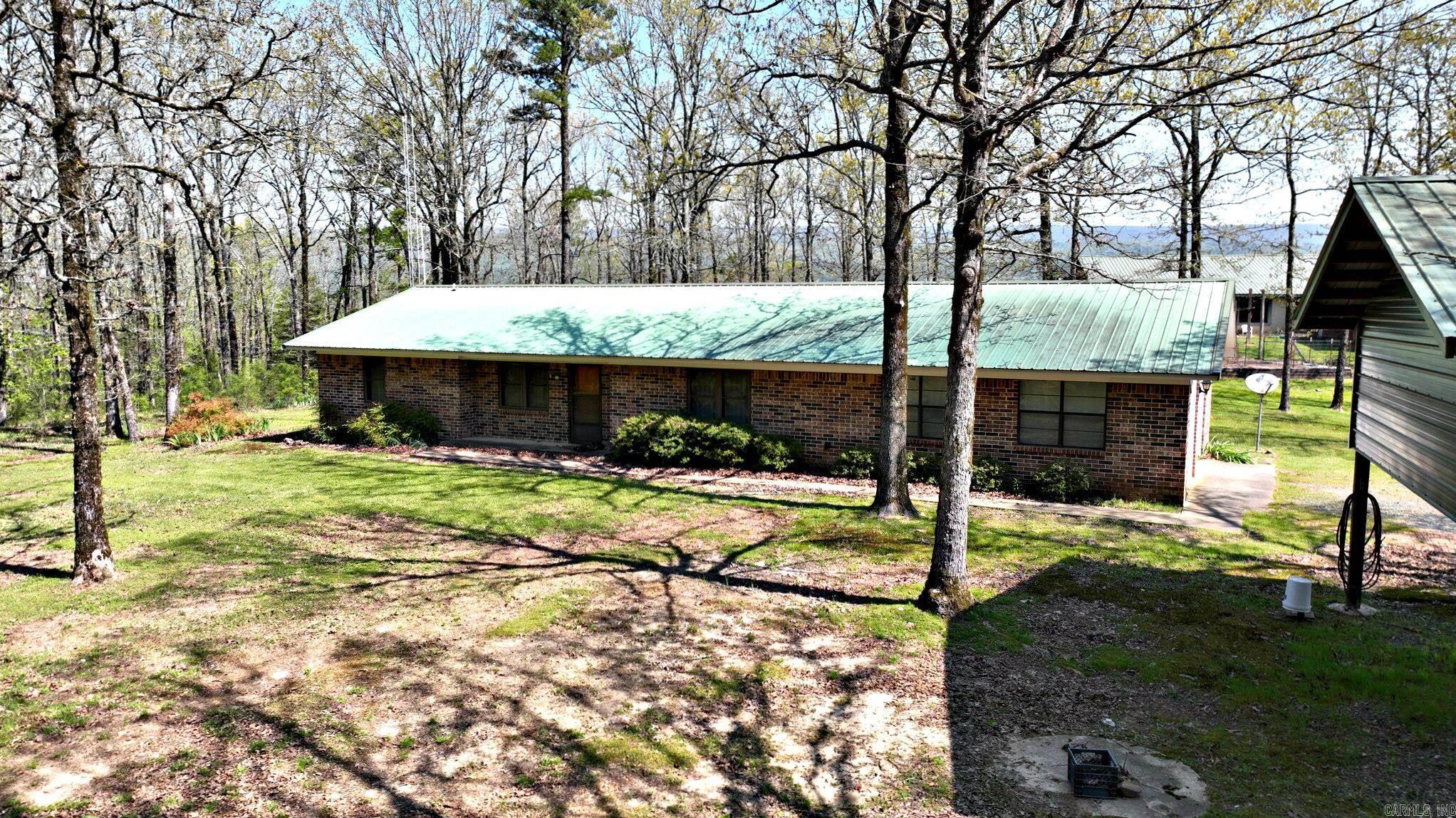 Unspoiled Country Charm in the Mountain Fork area. Tucked away from the hustle and bustle, this property offers 13.24 picturesque acres. The property is bordered by National Forest Service land, offering privacy, serenity, and direct access to nature. Several outbuildings provide ample storage, workshop space, or potential for hobbies—and one even features a basement/storm cellar for added safety and utility. Bring your RV! A dedicated hookup area includes water, septic, and a 30-amp connection—perfect for guests or extended outdoor living. Beautiful pond and amazing mountain views. Offering 1,464 square feet of comfortable living space, this well-insulated home is designed for both efficiency and year-round comfort. Well maintained 3 bedroom, 2 bath home, CH&A, and spacious rooms. A Yodor brand wood stove keeps things cozy in the cooler months, while a powerful 20 kW Generac generator ensures you're always covered, rain or shine. Whether you're looking for a quiet homestead, recreational escape, or a move-in ready rural lifestyle, this property offers a rare combination of comfort, utility, and stunning natural beauty. Sale contingent upon court approval. 50% mineral rights convey
