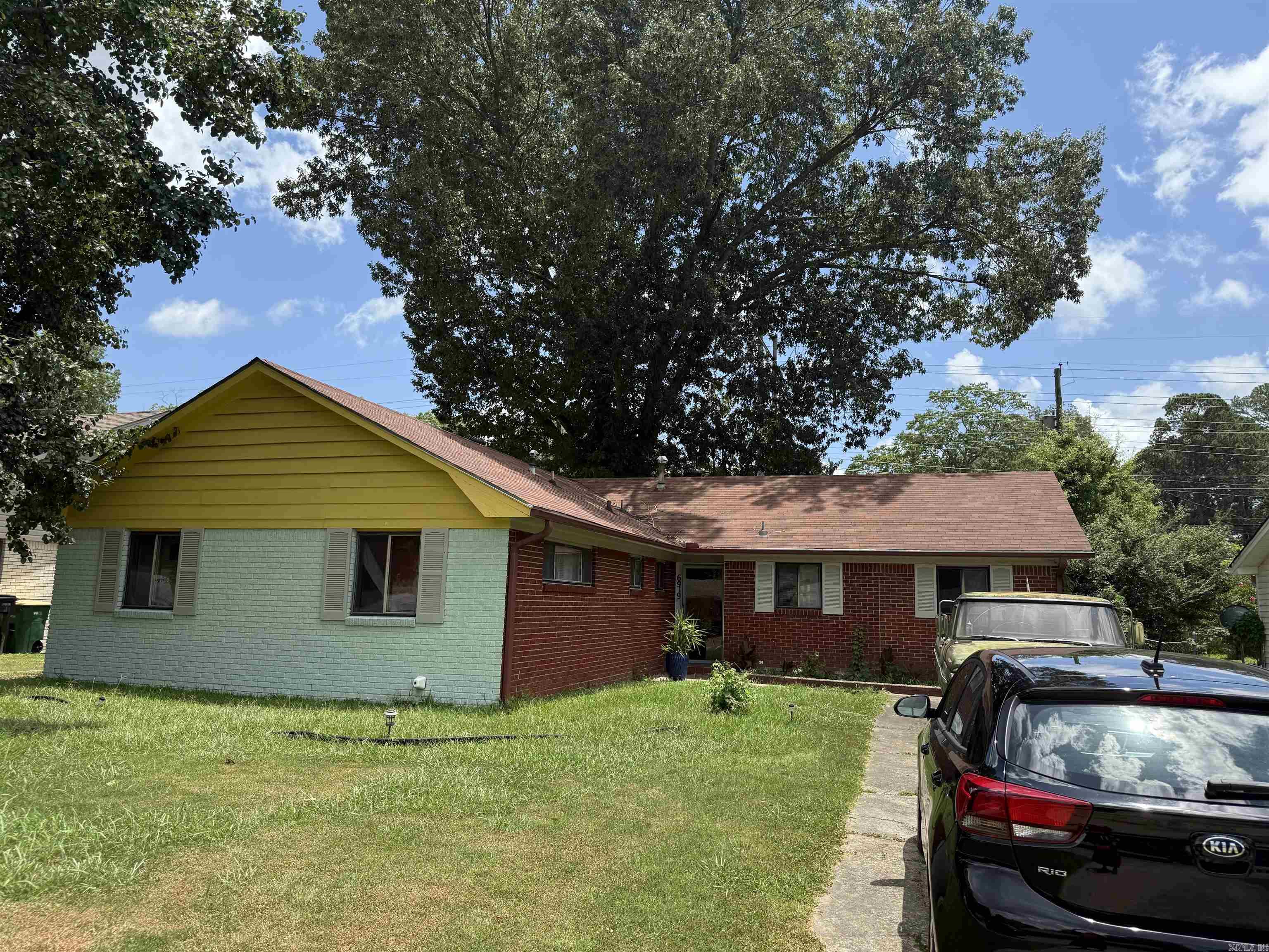 Brick 3 Bedroom, 2 Bath & Bonus room with 1662 sq ft. The Living/Den area has a large fireplace. The covered back patio has a built in kitchen area. Please note the owner is selling the home as is.