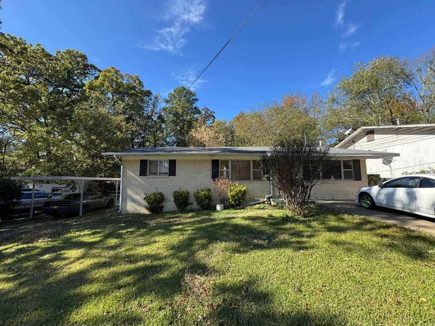 Take a look at this 3 Bedroom 1.5 bath house on two lots! One bedroom and half bathroom are situated on the right side of the house, the other two bedrooms and full bathroom are situated on the left side of the house.  Large living room, and spacious backyard. Potential to build on the extra lot that comes with the property. Near by a Wal-Mart and Kroger. Currently a long-term rental, occupied.