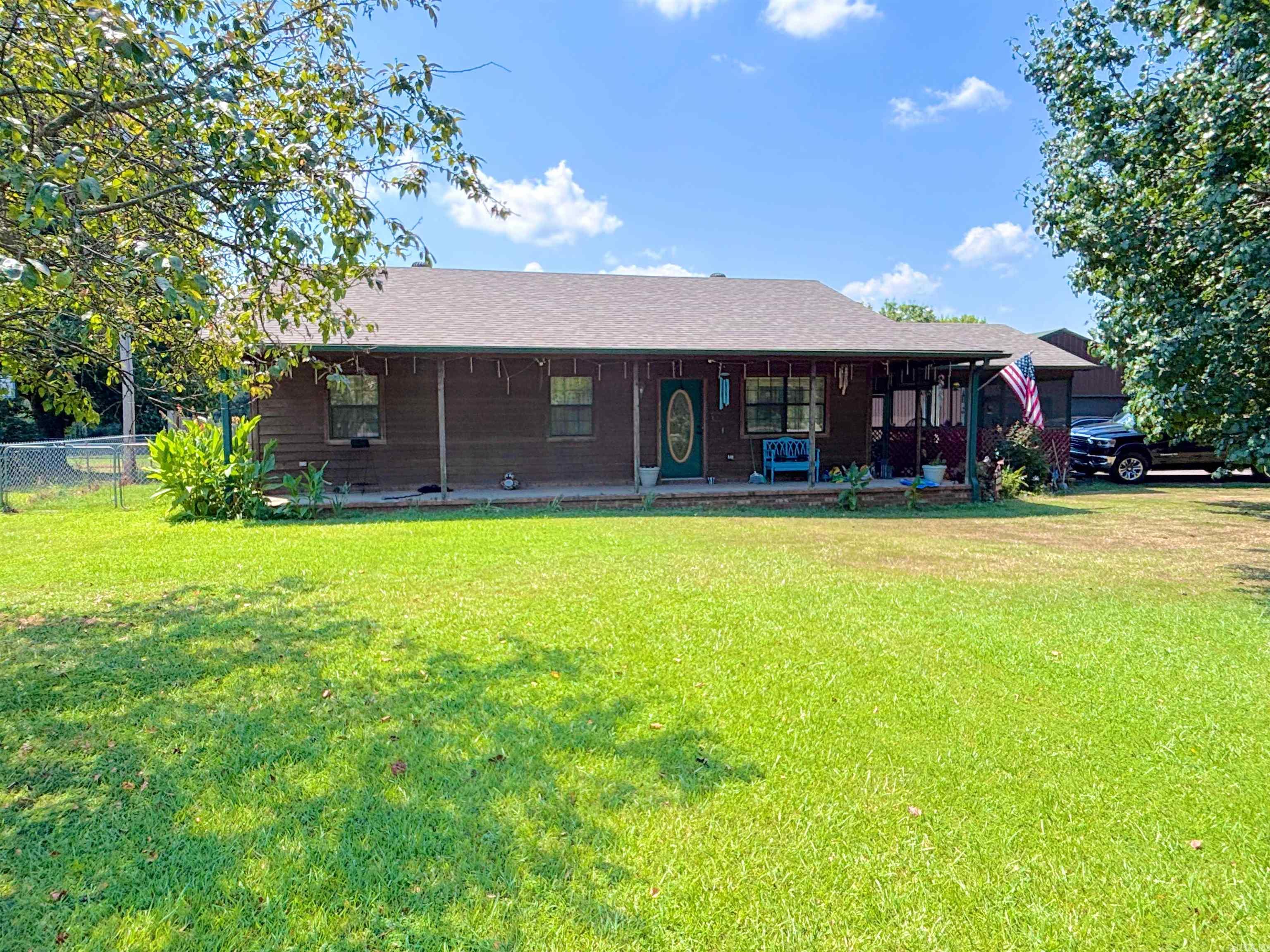 Welcome to this Charming Ranch-Style 3 bed 2 bath home in such a peaceful location with a screened in sunroom, great for all events or just to relax! It offers 1150 square foot of comfortable living space on .32 acres. Perfectly located close to shopping, restaurants and entertainment, this home provides convenience with comfort. Inside you will find all appliances convey including the washing machine, dryer and refrigerator, that are only 2.5 years old. This home also boasts a new water heater and a roof installed just 2.5 year ago, giving you peace of mind for years to come!! Step outside to enjoy the fenced-in backyard- perfect for pets, gardening or relaxing-and an inground storm shelter for added safety. A detached two-car garage sits sturdy on a concrete slab offering plenty of storage and workplace! You do not want to miss your chance!! Call today for your showing!