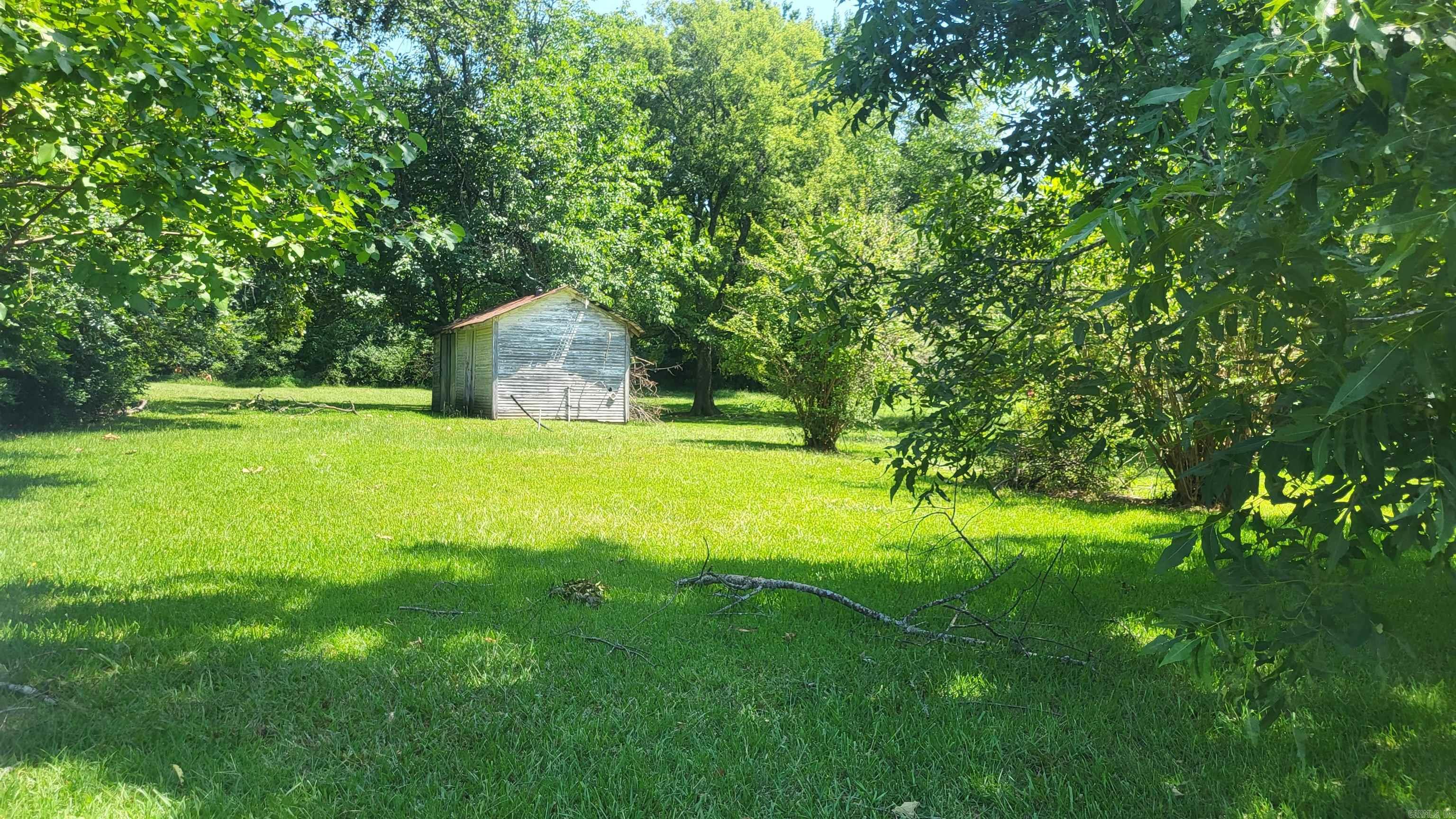 Excellent 1/2 acre lot inside city limits of Mena, near school