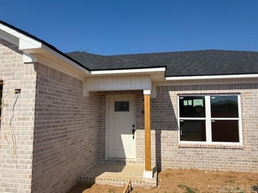 Beautiful new construction home tucked away in Parkview Estates.  All brick, 3 bed/2 bath home with granite countertops, tray ceiling in living room, and a spacious primary suite. Split floor plan with primary suite apart from other bedrooms. Extra room in the front bedroom corner for a desk that would make for the perfect office. Why pay high rent, when you can buy a new construction home?! Energy efficient windows, low maintenance stained concrete floors, and architectural shingles are just some of the many features that make this home a sound purchase. The back yard has a row of trees that lend to privacy and create a green space during the warm months. Great location with Morrilton schools, UACCM, and downtown Morrilton all within 5 minutes or less.  If you work in Little Rock or Conway but don't want to pay the prices to live in those areas, this is a great option! Easy access to I-40. This is a great price for a brand-new home! Tax estimate is based off of vacant land. Contact your lender to see if you qualify for $0 down payment on this home!  Agents, see remarks.