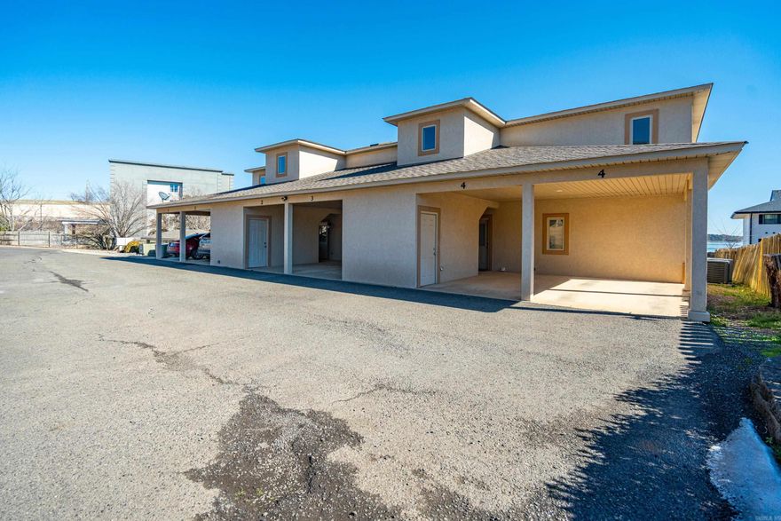Welcome to Unit C-4 at Waters Edge Condominiums, a light-filled corner residence offering an elevated lake lifestyle and income potential. High ceilings, a well-appointed kitchen, and an open floorplan offer a high-style, airy feel upon entry. Both the living area and primary suite open effortlessly to an expansive covered balcony--with a view--spanning the width of the condo. The kitchen and baths are finished with stone countertops, custom tile work, and generous storage, making this condo equally suited for full-time living, entertaining, or short-term rental use--which is permitted and offers strong income potential. Located in the popular 7-South corridor, you are just minutes from dining, shopping, and Hot Springs attractions. Waters Edge features gated entry, a beautiful pool, optional boat tie-ups, and two dedicated covered parking spaces—a rare and valuable convenience for lakefront condo ownership. With exterior maintenance handled by the association, Unit C-4 presents a low-maintenance opportunity as a refined lakefront getaway, second home, or investment property designed for flexibility and ease.