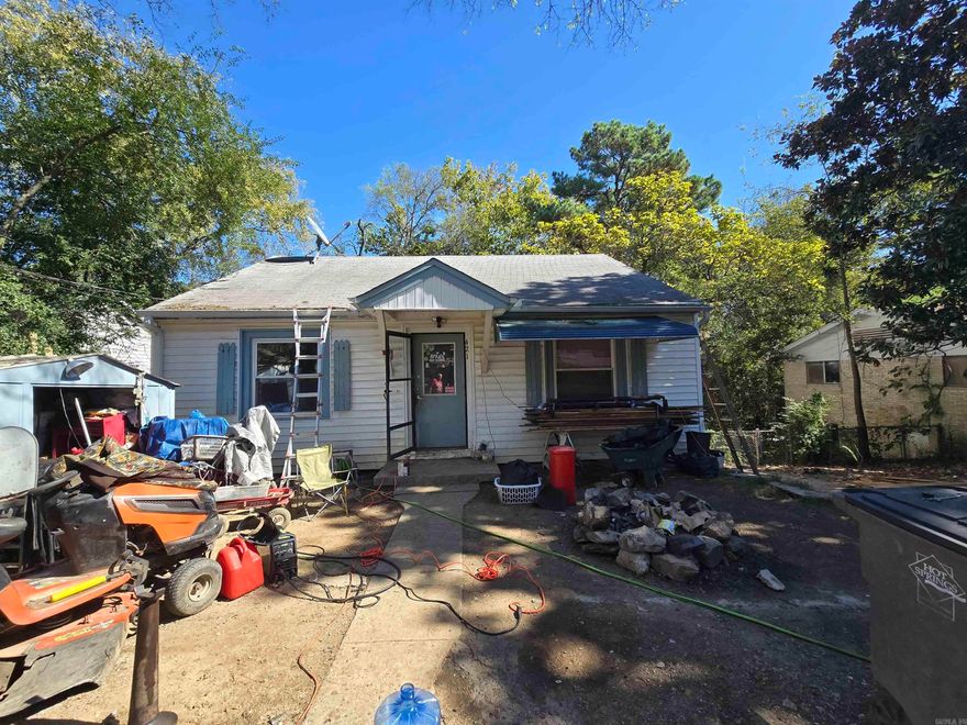 This home is in a prime location.  Minutes from shopping, hospitals, restaurants and two schools within walking distance as well as a daycare.  Large backyard  where you could add a tiny house or have a very nice garden.  Needs a little TLC but with just a little work could be a charmer.  Wood floors in good shape.  Large concrete floored storage space underneath the home.  Windows replaced about five years ago.  Seller says bring an offer and let's make a deal.