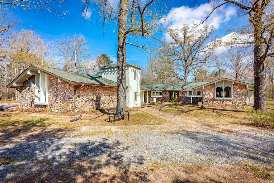 Discover the perfect blend of privacy, comfort, and modern updates with this 3-bedroom, 2.5-bath, single-story home set on over 7 tranquil acres. Complete Renovation in 2022 and Located just 30 minutes from Little Rock and only 2.5 miles from Tar Camp Park along the Arkansas River, this property offers both convenience and a peaceful retreat. This spacious 1-story home offers an updated kitchen featuring quartz countertops, a granite sink, custom oak cabinets, a stylish new backsplash, updated fixtures, and under-cabinet lighting, and dishwasher (2024). Other improvements include updated bathrooms, a newer HVAC system, and 1 of 2 water heaters new in 2024, Two fireplaces, and Pecky Cypress Entrance. Outside, the property truly shines with a newly built 38x60 barn (2024), gutters with leaf guards, and a dedicated RV pad with electrical hookup—perfect for storage, hobbies, etc. The expansive acreage provides endless opportunity to enjoy nature or recreation.