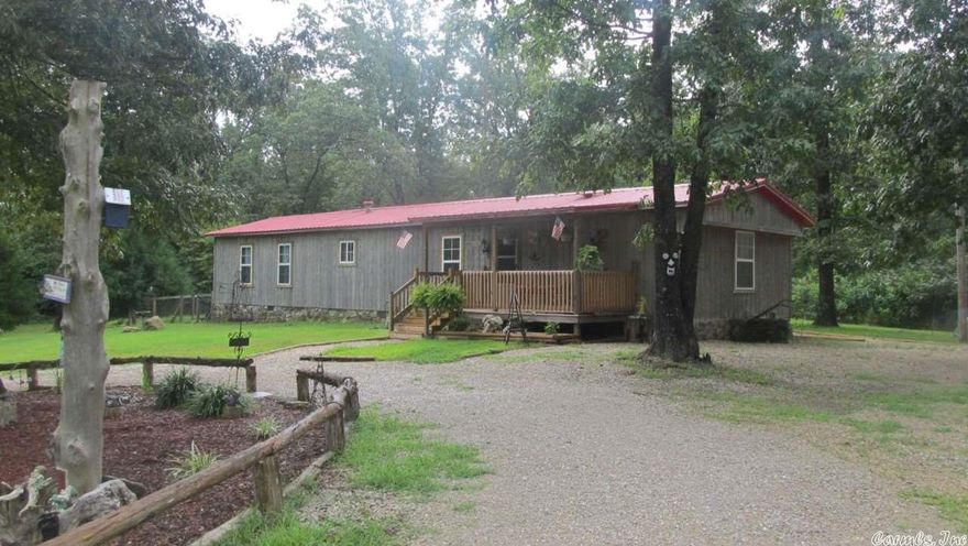 Beautiful Manufactured Home on 2 +/- Acres. Wait till you see the inside of this place! Totally remodeled from top to bottom with a new roof.  It offers 2 bedrooms, 2 bathrooms with the master bathroom offering a walk in shower,oak hardwood floors,tongue and grove pine ceilings, beautiful spacious kitchen with new counter tops and beautiful cabinets, central heat and air, utility room, covered back deck, then step outside to your 2 acres of land with a 12' x 24' storage/shop building.  Must see to believe.