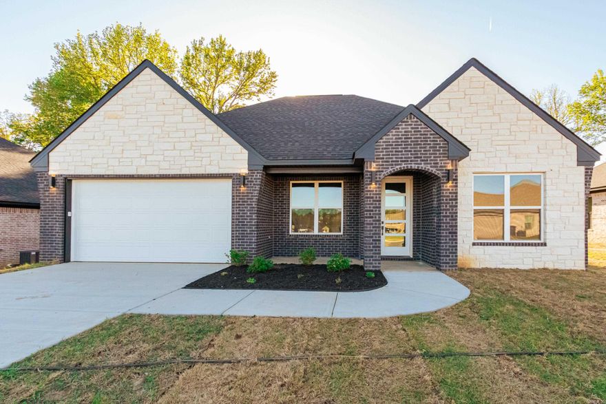 Jacksonville New Home! Enjoy this stunning new construction by Charles Anderson Homes! This residence boasts every luxury you could desire. The foyer opens up to a spacious Great Room with an inviting open floor plan and a stylish recessed electric fireplace. The kitchen and dining area showcase beautiful Quartz countertops, a range alcove with surround, and a large island that serves as additional dining space. Enjoy exquisite ceiling and cabinet fixtures throughout the home. The private Master Suite features double vanities, luxury vinyl flooring, a garden tub with upgraded tile surround, a custom tile shower, and two walk-in closets. On the opposite side, you'll find two bedrooms along with a guest bath and laundry room. Step outside to the covered porch, complete with an outdoor fireplace for cozy evenings. Plus, enjoy peace of mind with a One year Home Builder's Warranty!  PROFESSIONAL PICTURES COMING. COMPLETION DATE APRIL 1, 2026.