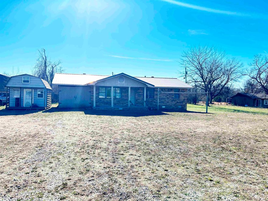 Versatile 3-Bedroom Home on 8+ Acres with Highway Frontage – Highland, AR  This versatile 3-bedroom brick home sits on 8+ acres in Highland, Arkansas, with prime frontage along US Highway 62/412, making it suitable for residential living or potential commercial use. The property includes a 1-car garage and a 6’ x 10’ storage shed, offering ample space for tools, equipment, or extra storage needs.  The mostly cleared, level acreage provides plenty of room for expansion and is well-suited for a horse or two. Conveniently located between Ash Flat and Hardy, this property offers excellent accessibility while maintaining a rural feel. City water and sewer are already in place, adding to the property’s value and convenience.  Whether you’re looking for a home, business location, or investment opportunity, this property offers flexibility, visibility, and room to grow.