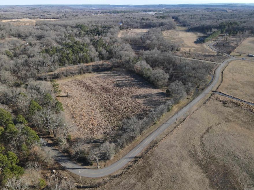 This unique property boasts paved road frontage on two sides and is conveniently located just over a quarter mile from Mayflower High School. A gated entrance ensures privacy and easy access. While much of the property is in the floodplain, approximately one acre along the road is buildable, making it an excellent site for a home or other development. The land features a blend of improved pasture and timber, with the remainder in unimproved pasture, offering versatility for agricultural or recreational use. Utilities, including electricity, water, and internet, are available along the road, and the property is partially fenced. Minerals owned by the seller will convey, adding further value to this offering. Whether you’re looking for a buildable homesite, agricultural potential, or a mix of both, this property provides a range of opportunities in a convenient location.