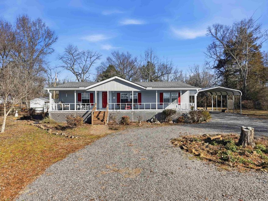Well-maintained 3-bedroom, 2-bath double wide on nearly an acre (.95 acres) with 1,440 sq ft of comfortable living space! This home features a permanent foundation, a large front deck with a swing, a screened-in back porch perfect for relaxing. Recent improvements include new carpet in 2024 and a newer HVAC system installed in 2022. The spacious primary bath offers both a walk-in shower and a walk-in bathtub for added comfort and accessibility. Septic system was pumped in 2025 for peace of mind. Enjoy country-style living with room to spread out while still being close to town. Schedule your private showing today!